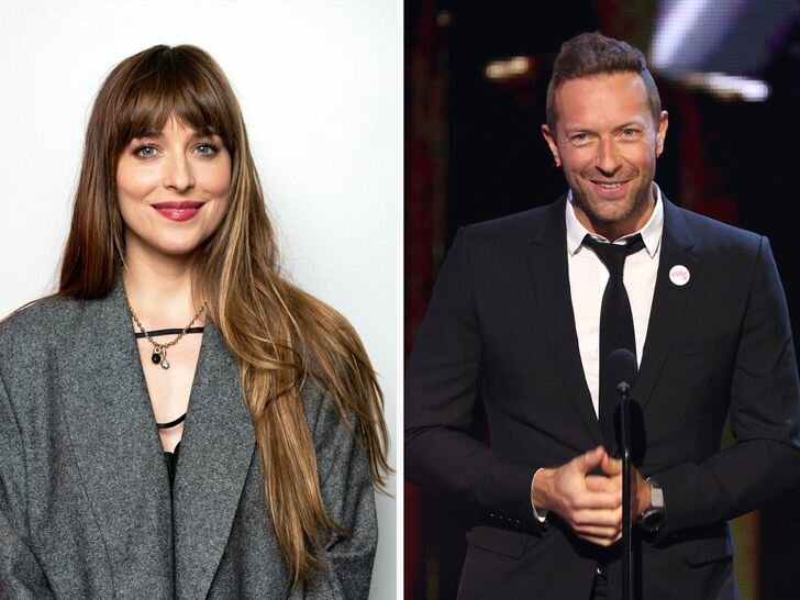 Dakota Johnson Gray Coat Soft Smile Chris Martin Suit on Stage Smiling