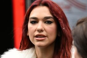 Dua Lipa Red Hair Braids White Fuzzy Coat Walking Around in London Doing Press for 'Houdini'