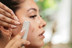 A woman using the Dermaflash.