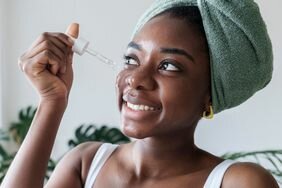 Woman applying skincare