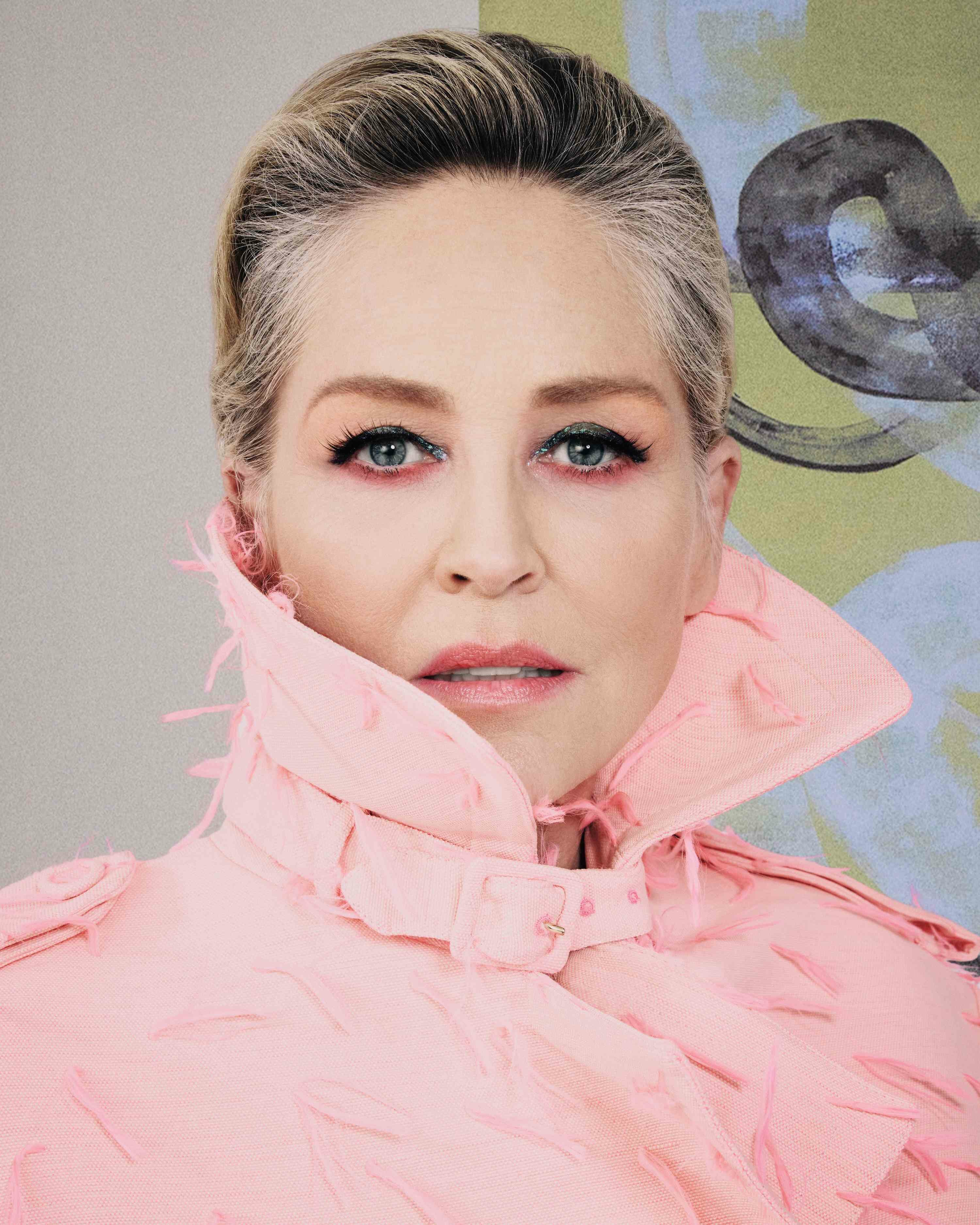 Sharon Stone pink coat green painting