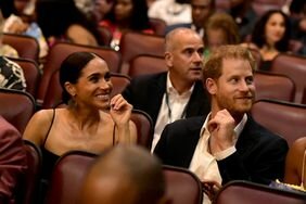 Prince Harry Meghan Markle Sitting in Theater Smiling Looking Off to the Side â€œBob Marley: One Loveâ€ Premiere in Jamaica 