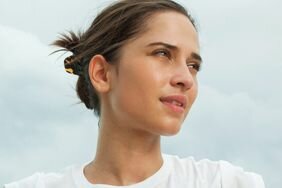 Person with clear skin with the sky in the background