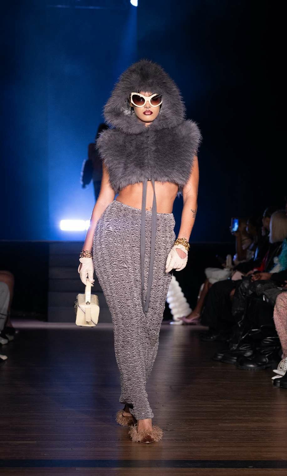 A Kim Shui NYFW model carries a top-handle bag, NYFW Fall 2024's best bag trend.