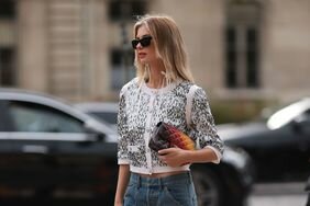 A woman wearing a sequin top