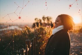 woman smiling on a sunny fall day