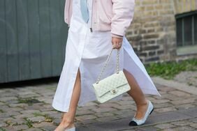 A woman wearing ballet flats