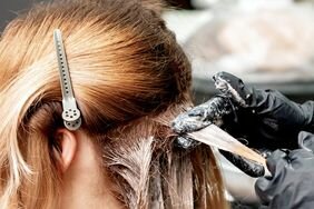 Woman getting her hair colored at the salon