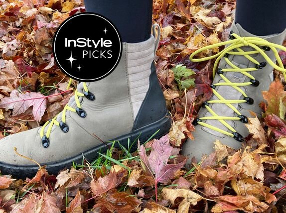 A person wearing the Bogs Women's Holly Lace Leather Boots in wet leaves