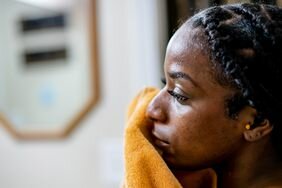 Woman with textured skin going through beauty care routine