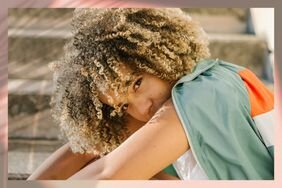 Person with curly natural hair bob with blonde highlights