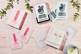 Three varieties of under-eye masks on a pink tile background