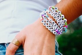 Woman wearing a letter friendship bracelet